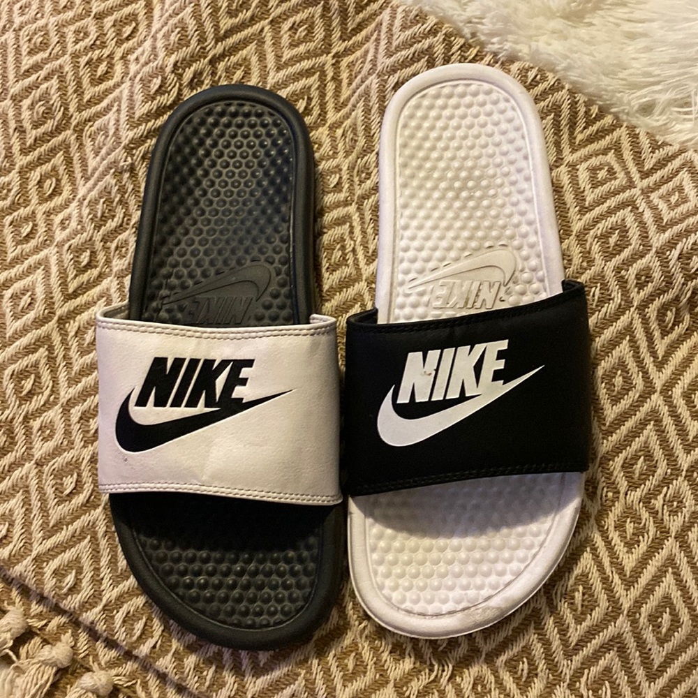 Black and white Nike slides